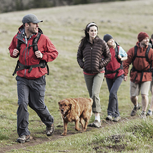 friends-with-dog-hiking-on-field-2022-01-31-20-27-35-utc.jpg